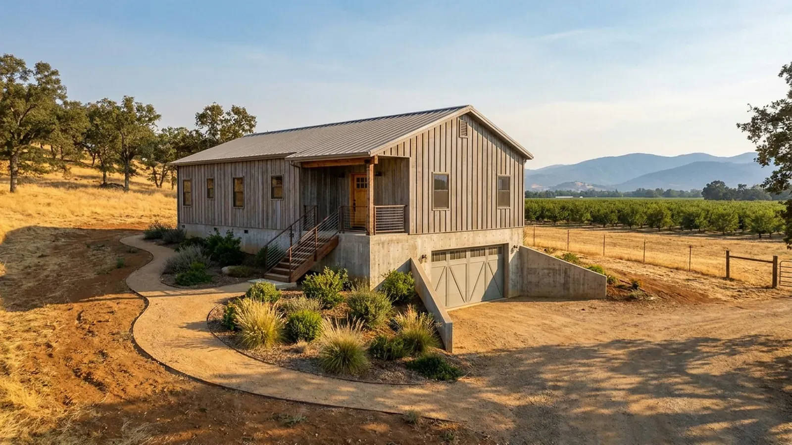 A barndominium raised on a stem-wall foundation with steps up to the entry and enclosed storage space beneath the elevated floor.
